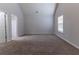 Spacious bonus room featuring neutral paint, carpet, and neutral colors at 204 Saintvry Path, Atlanta, GA 30349