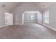 Spacious bonus room featuring neutral paint, carpet, with natural light from windows at 204 Saintvry Path, Atlanta, GA 30349