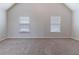 Bonus room featuring neutral paint, carpet, with natural light from windows at 204 Saintvry Path, Atlanta, GA 30349