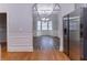 View of a dining area featuring a coffered ceiling and bay windows at 204 Saintvry Path, Atlanta, GA 30349