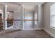 Upstairs hallway featuring wrought iron railing overlooking foyer at 204 Saintvry Path, Atlanta, GA 30349