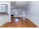 Spacious room boasting hardwood flooring, fireplace, and a door to the exterior at 204 Saintvry Path, Atlanta, GA 30349