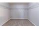 Walk-in closet featuring wire racks and carpet at 204 Saintvry Path, Atlanta, GA 30349
