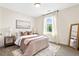 Comfortable bedroom with ample natural light, stylish décor, and plush carpeting at 213 Starr Cir, Stockbridge, GA 30281