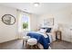 Inviting bedroom with ample natural light, comfortable seating, and stylish decor at 213 Starr Cir, Stockbridge, GA 30281