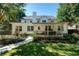 Expansive backyard featuring a well-manicured lawn, a charming covered porch, and a picturesque garden at 3265 Bethesda Park Ct, Lawrenceville, GA 30044
