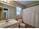 Bright bathroom with neutral walls, modern fixtures, decorative tile accent, and a combined shower and tub at 3265 Bethesda Park Ct, Lawrenceville, GA 30044