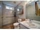Well-lit bathroom with tile flooring, modern fixtures, a shower, and a convenient built-in medicine cabinet at 3265 Bethesda Park Ct, Lawrenceville, GA 30044