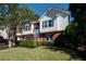 This lovely home has a combination brick and vinyl exterior, attached garage, and manicured landscaping at 3265 Bethesda Park Ct, Lawrenceville, GA 30044