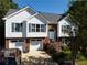 Inviting two-story home with a combination brick and vinyl exterior, attached garage, and manicured landscaping at 3265 Bethesda Park Ct, Lawrenceville, GA 30044