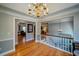 Welcoming foyer with hardwood floors, staircase, and decorative chandelier, providing a grand entrance to the home at 3265 Bethesda Park Ct, Lawrenceville, GA 30044