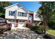 This inviting home boasts a beautiful brick and vinyl exterior, attached garage, and manicured landscaping at 3265 Bethesda Park Ct, Lawrenceville, GA 30044
