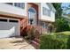 Charming home with well-maintained landscaping, brick accents, and a welcoming front entrance with decorative planters at 3265 Bethesda Park Ct, Lawrenceville, GA 30044