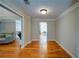 Elegant hallway with hardwood floors, leading to other areas of the home. Neutral paint at 3265 Bethesda Park Ct, Lawrenceville, GA 30044