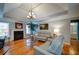 Relax in this living room offering hardwood floors, a trey ceiling, fireplace, and neutral paint colors at 3265 Bethesda Park Ct, Lawrenceville, GA 30044
