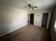Bedroom with a ceiling fan and closet that leads to a staircase at 2572 Stratford Ln, Morrow, GA 30260
