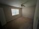 Bedroom with carpet, one window, and a ceiling fan at 2572 Stratford Ln, Morrow, GA 30260