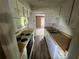 Bright kitchen with wood counters, offering a practical space for cooking, including stove and sink at 2572 Stratford Ln, Morrow, GA 30260
