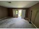 Cozy living room with a door leading to the outside, creating a seamless indoor-outdoor living experience at 2572 Stratford Ln, Morrow, GA 30260