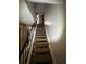Staircase leads to the upper level, offering access to additional living spaces and bedrooms at 2572 Stratford Ln, Morrow, GA 30260