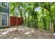 Scenic backyard featuring mature trees and an iron fence at 2814 Vinings Central Se Dr # 151, Atlanta, GA 30339