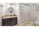 Bathroom with neutral vanity, a shower-tub combo, and decorative mirror at 2814 Vinings Central Se Dr # 151, Atlanta, GA 30339