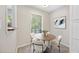 Bright dining area with a wood table, modern chairs, and a window view at 2814 Vinings Central Se Dr # 151, Atlanta, GA 30339