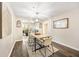 Bright dining room with modern lighting, wood floors, and seating for four at 2814 Vinings Central Se Dr # 151, Atlanta, GA 30339