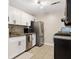 Efficient kitchen with stainless steel appliances, granite countertops, and white cabinetry at 2814 Vinings Central Se Dr # 151, Atlanta, GA 30339