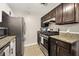 Well-appointed kitchen with stainless steel appliances and granite countertops at 2814 Vinings Central Se Dr # 151, Atlanta, GA 30339