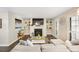 Cozy living room featuring a fireplace, built-in shelving, and a comfortable sofa at 2814 Vinings Central Se Dr # 151, Atlanta, GA 30339