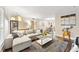 Open-concept living room with stylish decor, hardwood floors, and a large sectional sofa at 2814 Vinings Central Se Dr # 151, Atlanta, GA 30339