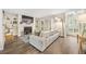 Living room featuring a fireplace, built-in shelving, and wood floors at 2814 Vinings Central Se Dr # 151, Atlanta, GA 30339