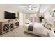 A bright main bedroom features a ceiling fan, a double door opening to the outside and a comfortable bed at 2814 Vinings Central Se Dr # 151, Atlanta, GA 30339