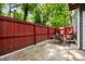 Private outdoor patio with mature landscaping and a cozy seating area at 2814 Vinings Central Se Dr # 151, Atlanta, GA 30339