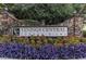 Vinings Central Condominiums signage surrounded by colorful flowerbeds and stone columns at 2814 Vinings Central Se Dr # 151, Atlanta, GA 30339
