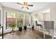 Cozy sun room featuring a ceiling fan, breakfast bar and large windows at 2814 Vinings Central Se Dr # 151, Atlanta, GA 30339