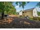 Large backyard with a hot tub, patio area, and partially wooded area, offering privacy and space for outdoor enjoyment at 5035 Pattingham Dr, Roswell, GA 30075