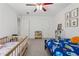 Bright ' bedroom featuring two beds, cheerful decorations, and ample natural light, great for shared space at 5035 Pattingham Dr, Roswell, GA 30075