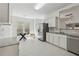 Spacious kitchen area with stainless steel appliances, breakfast nook and bright natural lighting at 5035 Pattingham Dr, Roswell, GA 30075