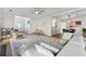Bright, open-concept living room with hardwood floors and neutral decor at 5035 Pattingham Dr, Roswell, GA 30075
