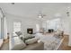 Inviting living room featuring a fireplace, hardwood floors, and natural light at 5035 Pattingham Dr, Roswell, GA 30075