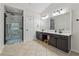 Main bathroom featuring tile flooring and frameless glass shower at 5035 Pattingham Dr, Roswell, GA 30075