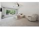 Spacious main bedroom featuring a large window with backyard view at 5035 Pattingham Dr, Roswell, GA 30075