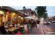 Outdoor dining in Roswell, Georgia, with a vibrant atmosphere, beautiful street and brick buildings at 5035 Pattingham Dr, Roswell, GA 30075