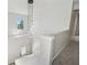 Stairwell featuring modern pendant lighting and neutral decor at 5035 Pattingham Dr, Roswell, GA 30075