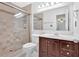 Clean bathroom with glass-enclosed shower, tile surround, and vanity with dark wood cabinets at 1438 N Crossing Ne Dr, Atlanta, GA 30329