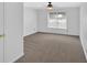 Bright bedroom with neutral carpet, ceiling fan, and a window offering natural light at 1438 N Crossing Ne Dr, Atlanta, GA 30329