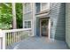 Inviting front entrance with a gray wood porch and painted siding at 1438 N Crossing Ne Dr, Atlanta, GA 30329
