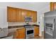 Kitchen with stainless steel gas range and granite counters at 1438 N Crossing Ne Dr, Atlanta, GA 30329